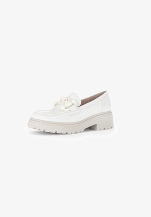 White leather loafers with a chunky cream sole, featuring a decorative chain accent on the vamp, smooth texture, and rounded toe design.