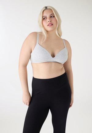 - Biustonosz z trójkątną miseczką