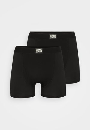 Black boxer shorts made from stretchy fabric, featuring a soft waistband with a logo tag. Smooth texture and fitted design.