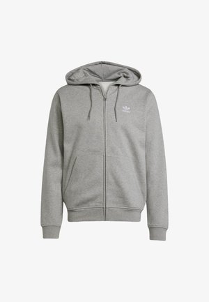 Siva zip-up dukserica napravljena od mekanog materijala, sa velikim prednjim džepom, kapuljačom sa vezicom i malim bijelim logom na prsima.