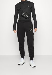 Puma Jogginghose - black