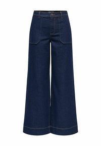 Jean large en denim bleu foncé, avec une taille haute, de grandes poches avant et des coutures orange contrastantes aux coutures.