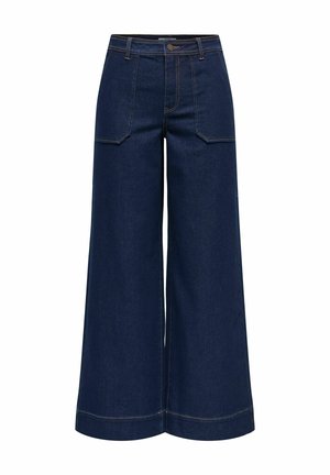 Bredbukser i mørkeblåt denim med høj talje, store forlommer og kontrasterende orange syninger ved sømmene.