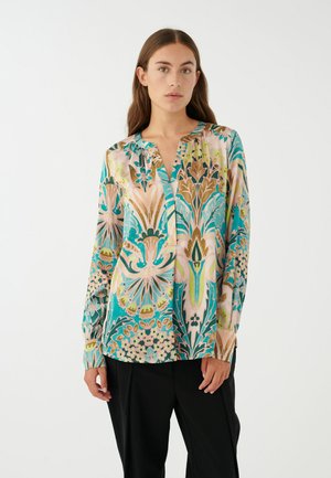 Bluse mit floralem Muster in Türkis-, Pink- und Goldtönen. Mit V-Ausschnitt und langen Ärmeln. Weicher Stoff mit lockerer Passform.