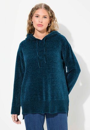 Teal velour huppari, jossa on säätöhihna, pitkät hihat, ribbihelma ja sivureiät. Mukava, pehmeä pinta, joka sopii arkikäyttöön.