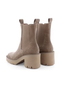 Tan suede ankle boots with elastic side panels, a chunky block heel, and a ridged sole, featuring a simple, streamlined design.