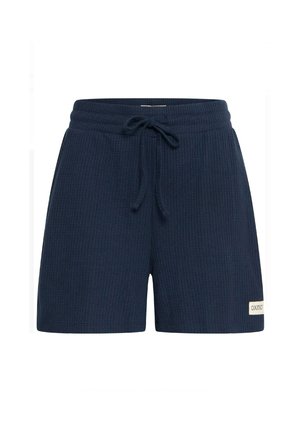 Shorts en tricot côtelé bleu marine avec un waistband élastique, un cordon de serrage et une petite étiquette de marque rectangulaire sur l'ourlet de la jambe gauche.