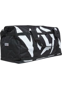 Black duffel bag with white abstract pattern, dual handles, and removable shoulder strap. Made of durable fabric. Zippered closure.