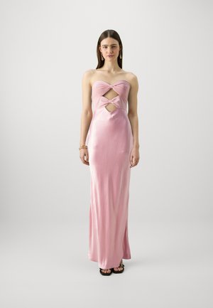 Pink satin strapless gown with cutout details and knotted accents. Floor-length design with a smooth texture and fitted silhouette.