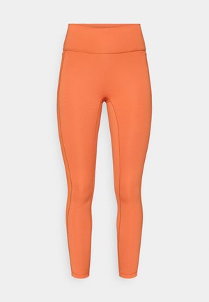 Leggings de cintura alta em laranja vibrante, feitos de tecido elástico. Apresentam textura suave e costuras flat-lock para maior conforto.
