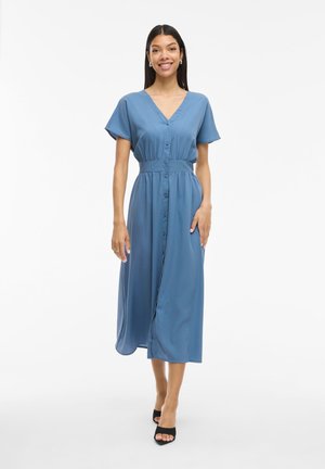 Blue midi dress with short sleeves, V-neckline, button front, gathered waist, and a flowing skirt. Smooth fabric with a lightweight texture.
