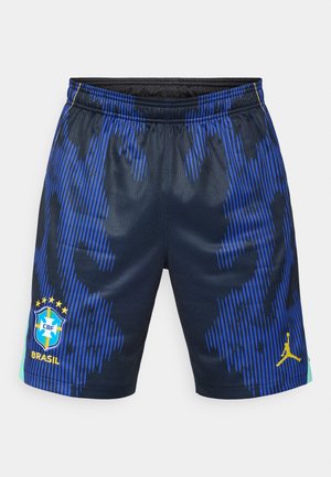 Temno modre športne hlače s pokončnim modrim vzorcem črt, z rumenim logotipom CBF in emblemom Jordan, elastičnim pasom in lahkim materialom.