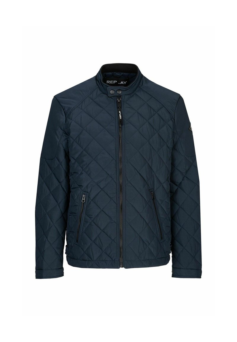 Giubbotto trapuntato blu navy con colletto alto, chiusura con zip e due tasche frontali con zip, caratterizzato da una texture liscia e dettagli minimi.