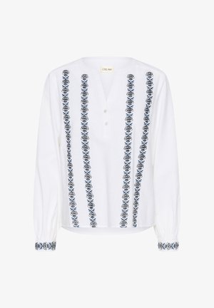 Balta ilga piedurkne blūze ar tumši zilu florālo izšuvumu gar priekšu un piedurkņu galiem, ar V veida izgriezumu un pogu aizdari.