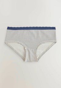 Culottes pour femmes blanches et bleu marine à rayures avec bordure en dentelle bleu marine le long de la taille, posées à plat sur un fond clair.
