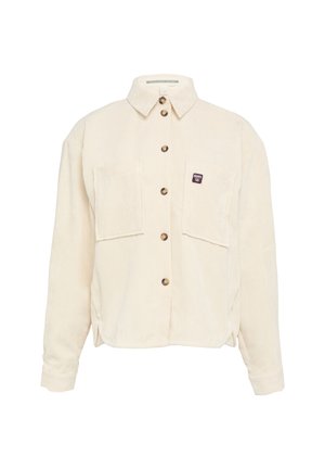 Cream corduroy shirt with a button-up front, two chest pockets, and a small label. Features a classic collar and ribbed texture.