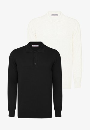 Black and white long-sleeve polo shirts stacked; both feature three buttons and ribbed cuffs. Black has a smooth texture, white is slightly textured.