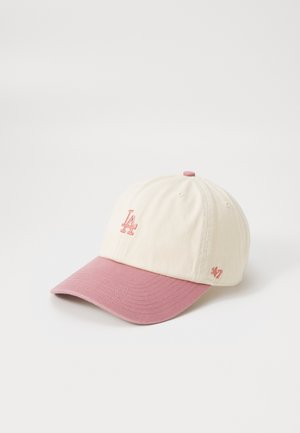Cap made of cotton; features a beige crown and a pink peak. Includes embroidered LA logo and branding on the side. Plain texture, softly structured.