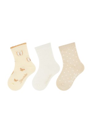 Drei Paar Knöchelsocken: gelb mit Schmetterlingsmuster, weiß mit kleinen Punkten und beige mit Tupfen. Weiches Strickmaterial, gerippte Bündchen.