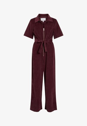 Burgundski kordurov kombinezon z kratkimi rokavi, zadrgo spredaj, dvema prsnikovima žepoma, pasom z zaponko in širokim krojem nogavic.