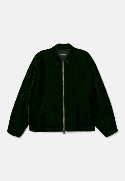 Mörkgrön bomberjacka i ett slätt material, med en framtida dragkedja, två sidfickor och en klassisk kragsdesign.