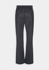 Schwarze Hose mit vertikalen weißen Nadelstreifen, elastischem Bund und lockerem Schnitt, gefertigt aus glattem, leichtem Stoff.