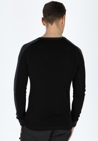 Black long-sleeve shirt with grey raglan sleeves, made of a smooth material. Features a rounded neckline and fitted design.