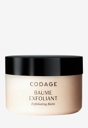 Peelingbalsam in einem runden, opaken beige Farbtiegel mit einem glänzenden schwarzen Deckel. Auf dem vorderen Etikett sind "CODAGE" und "BAUME EXFOLIANT" in fettem Text zu sehen.