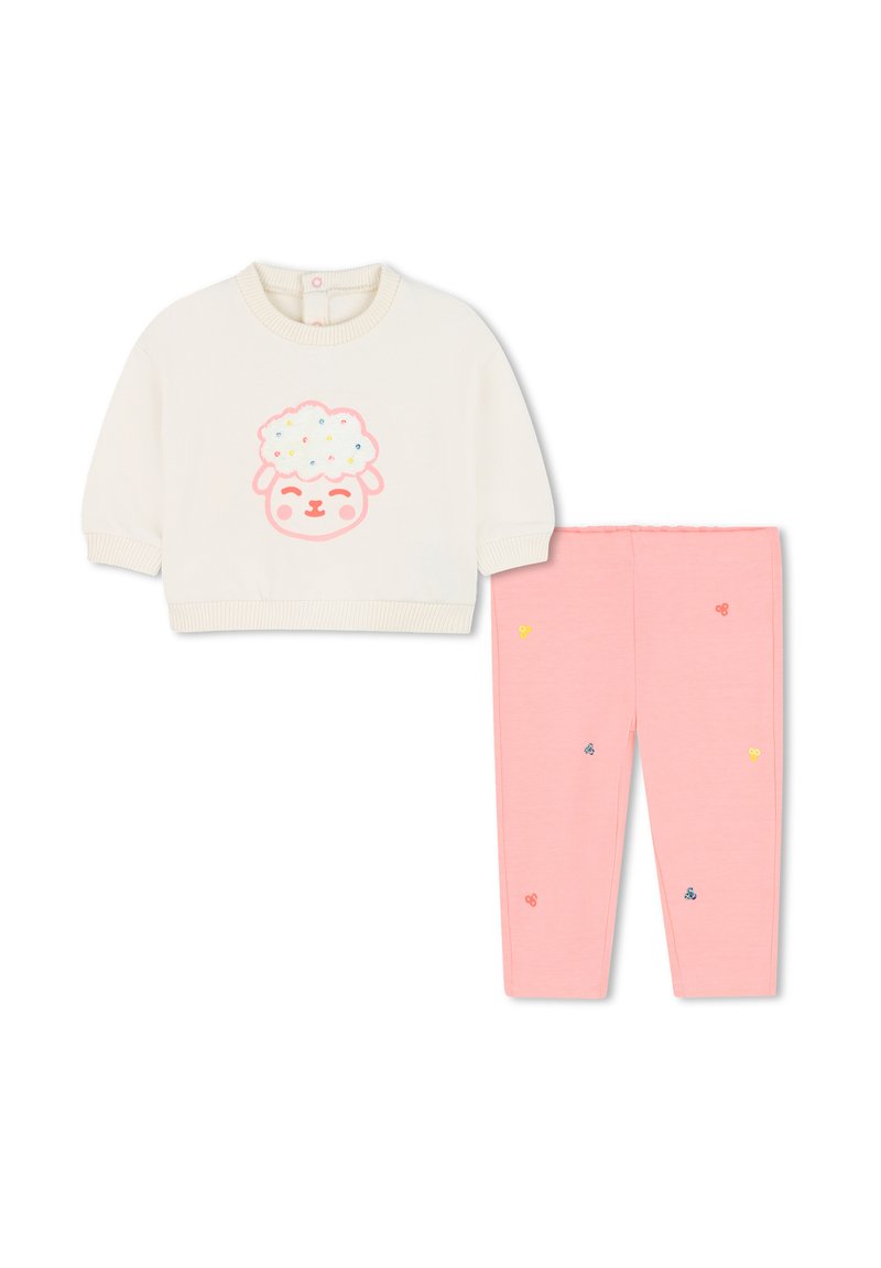 Chemise bébé crème à manches longues avec un visage de mouton souriant et pantalon rose avec broderie florale multicolore.