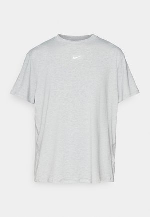 Gray short-sleeve T-shirt made of soft material, featuring a crew neckline and a small white Nike logo on the chest. Relaxed fit.