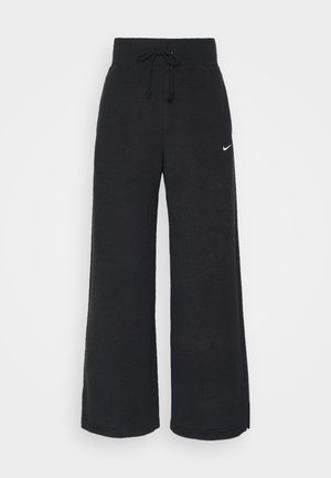 Pantaloni della tuta neri con gambe larghe, realizzati in un tessuto morbido. Presentano un elastico in vita con coulisse e un piccolo logo bianco sul lato.