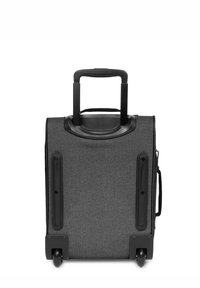 Maleta rodante de tela gris con un mango superior, dos ruedas y superficie lisa. Presenta un diseño compacto y acentos de plástico negro duraderos.