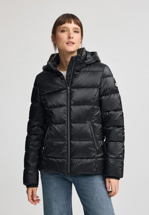 Giacca a vento nera, dotata di cappuccio, design trapuntato, chiusura frontale con zip e due tasche laterali con chiusura a zip. Tessuto liscio e lucido.