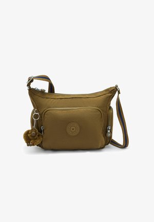 Sac bandoulière marron avec poche zippée à l'avant, sangle réglable rayée bleu et marron, et petit porte-clés singe en peluche attaché.