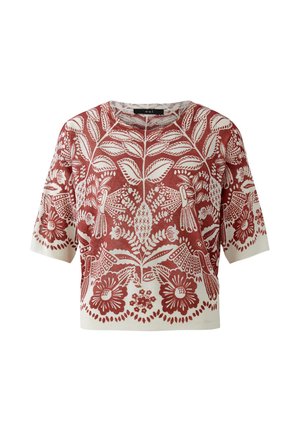 Korte mouw gebreide trui met roestrood-wit bloemen- en bladpatroon over de voorkant en mouwen, ronde halslijn.