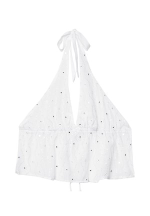 White halter top with a deep V-neck, featuring a ruffled hem, textured fabric, and small sequin embellishments across the surface.