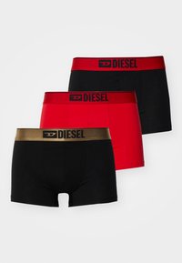 Set of three boxer briefs in black, red, and a black pair with a golden waistband. Features logo on the waistband, smooth fabric.