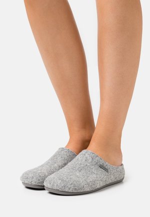 Gray felt slip-on slippers with a smooth, rounded shape and textured upper, featuring a subtle logo accent on the side and a flat sole.
