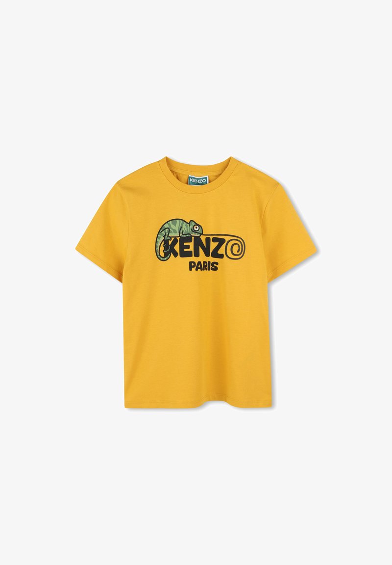 T-shirt en coton jaune présentant un graphisme de caméléon et "KENZO PARIS" imprimé en lettres noires en gras. Encolure ras du cou et manches courtes.