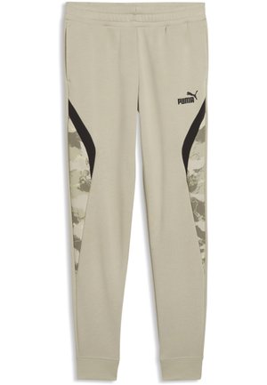 Pantaloni della tuta Puma beige chiaro con vita elasticizzata, logo nero sulla coscia e pannelli con motivo mimetico lungo le gambe.