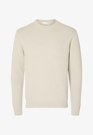 Beige knitted sweater with a crew neckline, ribbed cuffs, and hem. Features a textured fabric in a solid, neutral color.
