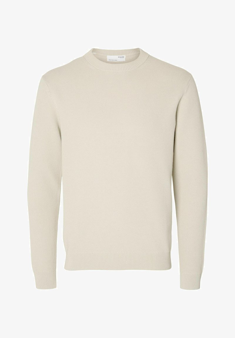 Beige strikket genser med rund hals, ribbede mansjetter og nederkant. Har et teksturert stoff i en ensfarget, nøytral farge.