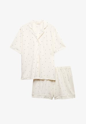 White short-sleeve button-up shirt and shorts pajama set with small black polka dots, elastic waistband on shorts.