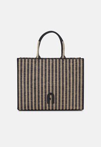 Woven tote bag featuring a structured shape, dark blue and natural straw-like material, dual top handles, and a prominent black logo detail.