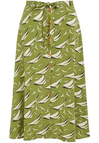 Green fabric skirt featuring a boat and bird pattern, with a front button closure and a tied belt. The design includes beige and black accents.