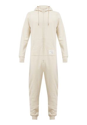 Beige hættezip-up onesie lavet af blødt stof, med en lomme foran og snore. Inkluderer et Etikette på den nederste venstre side.