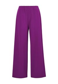 Pantalons larges violets avec une taille élastique, fabriqués dans un tissu doux et lisse, présentant une coupe fluide et sans poches visibles.