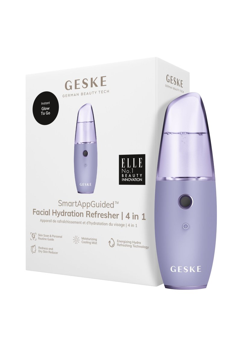 Rafraîchisseur d'hydratation faciale violet avec un design arrondi, un réservoir transparent et un bouton circulaire. Emballé dans une boîte blanche avec les détails du produit.
