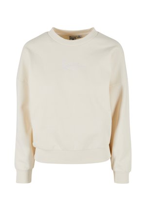 Creme sweatshirt med ribbet rund halsudskæring, lange ærmer og en afslappet pasform. Sømmer med diskret signaturbroderi i hvidt på forsiden.