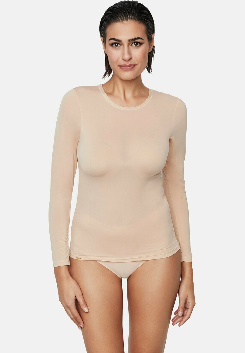 Haut long à manches nues fabriqué à partir d'un tissu transparent et stretch. Il présente un col rond et un design près du corps, avec des bords lisses et sans couture.